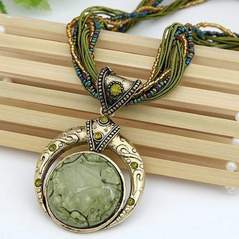 Vintage necklace with ethnic green crystal pendant. 0